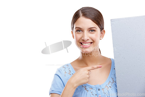 Image of Portrait, point and poster with a woman in studio isolated on a white background holding a blank sign for branding. Logo, marketing and brand with a female showing mockup space for advertising