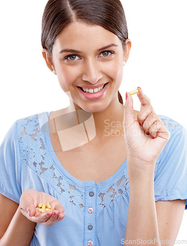 Image of Portrait, tabket and medicine with a model woman in studio isolated on a white background for vitamins or supplements. Medical, health and pills with a young female on blank space for medication