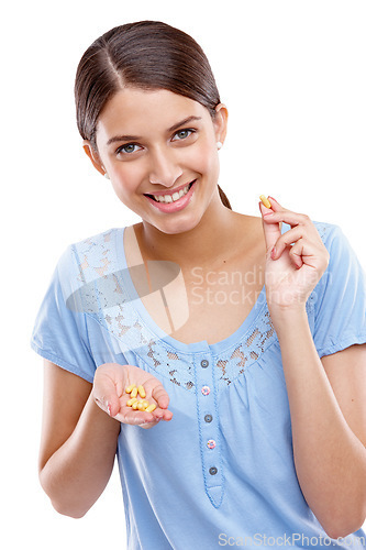 Image of Portrait, pills and medical with a model woman in studio isolated on a white background for vitamins or supplements. Medicine, health and tablet with a young female on blank space for medication