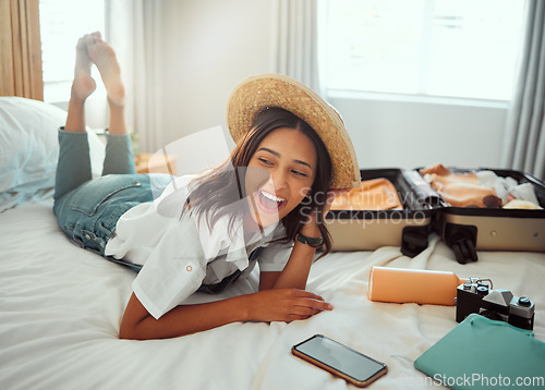 Image of Happy, travel packing and woman on a hotel bed with suitcase ready for summer vacation. Luggage, bedroom and smile of a person relax in accommodation with clothes or happiness about traveling journey