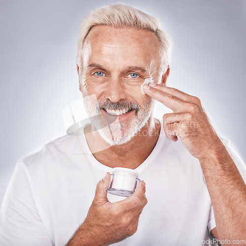 Image of Skincare, face cream and senior man portrait on white background for beauty, wellness and dermatology. Cosmetics, grooming and elderly male with anti aging beauty products, spa treatment and facial