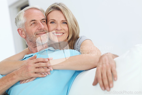 Image of Senior couple, hug and happy portrait with love at home for trust, care and support for retirement. Commitment of man and woman in a healthy marriage and lifestyle with security on living room couch