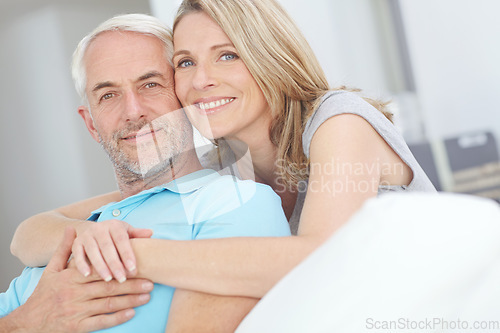 Image of Old couple, love and happy portrait in their home with trust, care and support for retirement lifestyle. Senior man and women in a healthy marriage with commitment and security on a living room couch