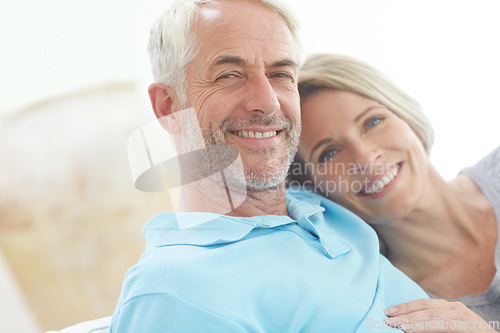 Image of Senior couple, retirement and portrait in their home with love, care and support from life insurance. Commitment of a man and woman in a healthy and happy marriage with security on living room couch