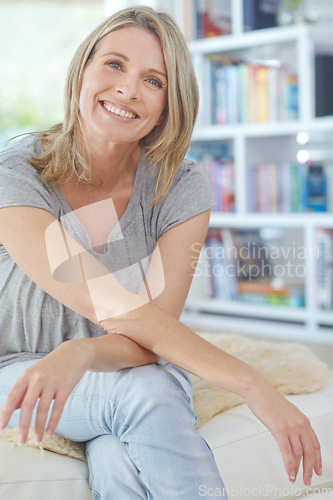 Image of Woman, happy portrait and relax on sofa in home for mindfulness happiness, positive mindset and calm energy. Female, smile and relaxing peace, pensive and vision or lifestyle motivation on couch