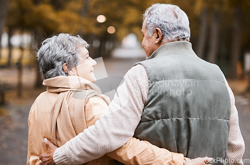 Image of Senior couple, love and health while walking outdoor for exercise, happiness and care at a park in nature for wellness. Old man and woman together in a healthy marriage during retirement with freedom