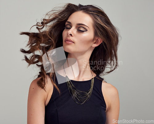 Image of Shake hair, beauty makeup and woman with eyeliner, luxury skincare and facial cosmetics. Salon wavy hairstyle, spa hair care and aesthetic model girl with shampoo healthy hair on studio background