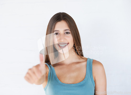 Image of Thumbs up, happy portrait and woman in studio, white background or isolated review. Female model, thumb up and support of yes agreement, celebration and like emoji for vote, trust and success sign