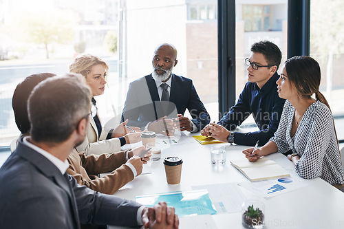 Image of Meeting, team and business people in discussion in the office planning a corporate strategy together. Diversity, teamwork and professional employees working in collaboration on a project in workplace