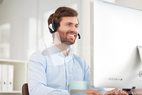 Image of Call center, computer and businessman with smile for virtual support, communication and software help in information technology office. Happy corporate worker with technology for telemarketing sales