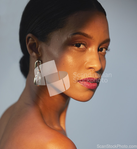 Image of Portrait, beauty and skincare with a model black woman in studio on a gray background for natural care. Face, cosmetics and wellness with an attractive young female posing to promote a luxury product