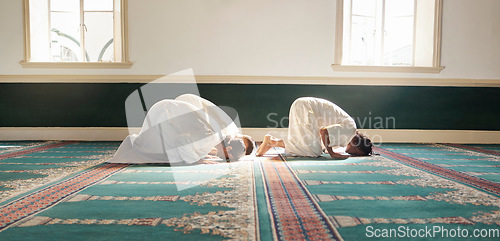 Image of Muslim, prayer and mosque with a spiritual man group praying together during fajr, dhuhr or asr, otherwise maghrib or ishaa. Salah, worship and pray with islamic friends observing ramadan tradition