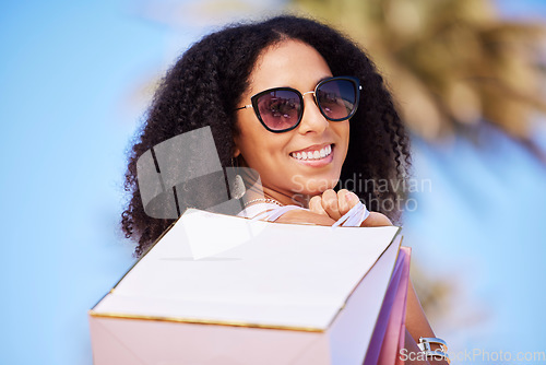 Image of Freedom, summer and girl with shopping bag portrait and smile in sunny Los Angeles, USA. Happy, consumerism and trendy black woman fashionista girl with retail bags for stylish lifestyle.