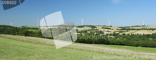 Image of Panorama of windfarm over a hill 