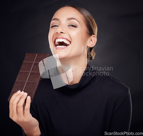 Image of Chocolate, diet and beauty with woman and skincare with healthy candy, luxury and wellness with food and portrait. Happy female with calories, cosmetic and cacao with skin with studio background