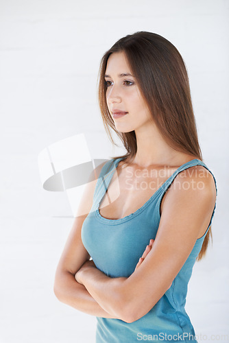 Image of Young woman, arms crossed and thinking for happiness, and female isolated on white studio background. Girl, lady and gesture with focus, concentration and idea with confidence, mindset and wellness