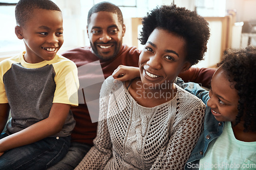 Image of Black family, smile and relax on living room sofa for happy bonding or quality time together at home. African American mother, father and children relaxing and smiling for family holiday on the couch