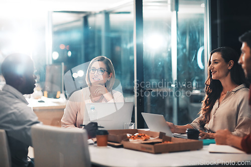 Image of Business, late night and team at workshop with ideas, laptop and pizza planning startup project. Teamwork, overtime and diversity, dinner for men and women brainstorming at creative marketing agency.