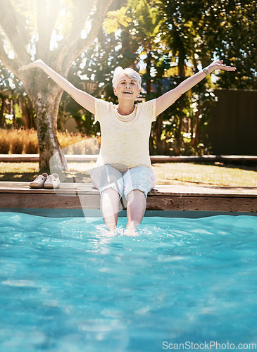 Image of Senior woman, smile and feet in swimming pool in relax for summer vacation, swim or holiday joy in the outdoors. Happy elderly female with arms stretched out in happiness for relaxation by water pool