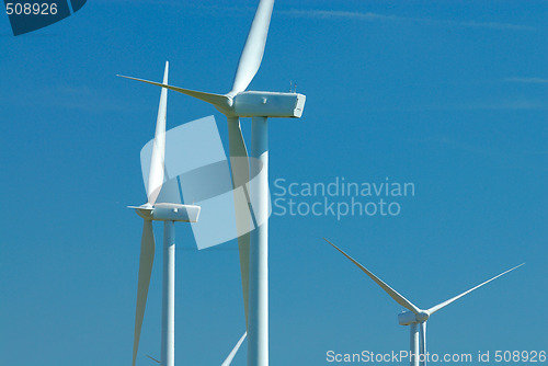 Image of three windturbines on blue sky
