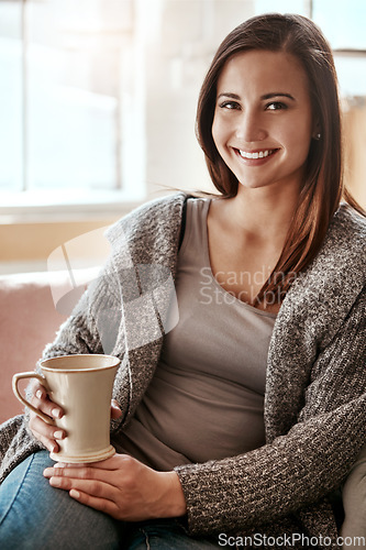 Image of Smile, woman and coffee portrait at home on a living room sofa feeling calm and relax. House, tea and morning happiness of a person with a drink on a house lounge couch peaceful and smiling alone