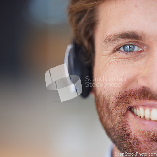 Image of Call center man, closeup and smile in portrait for customer service, happy and focus with headphones. Customer support, crm expert and happiness in zoom of face, eye and telemarketing job in Orlando