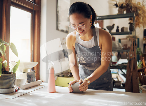 Image of Happy, pottery and woman in workshop with clay for creativity, inspiration and art process. Creative asian small business girl working at artistic workspace with excited smile in Tokyo, Japan