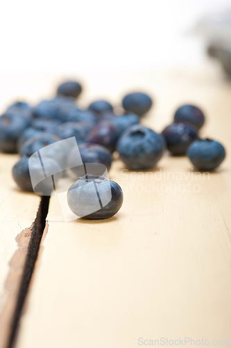 Image of fresh blueberry on white wood table