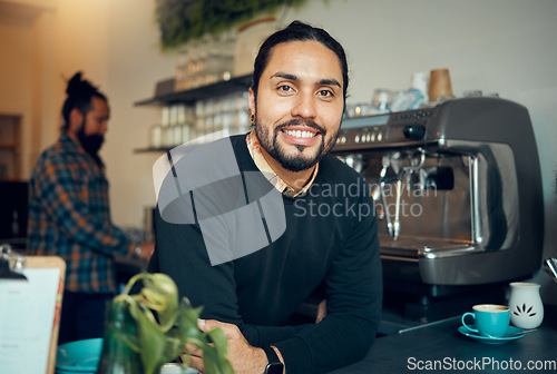 Image of Portrait, coffee shop and barista with a man at work behind the counter in a cafe or restaurant as a waiter. Manager, retail or small business with a male employee working in a cafeteria for service