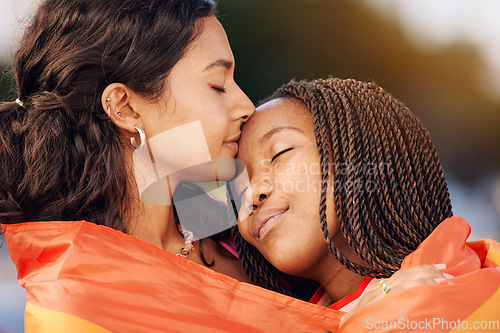 Image of Hug, love and lgbtq couple with a flag for sexuality pride, relationship freedom and comfort with partner in city of New Zealand. Diversity, affection and gay lesbian women with freedom in community