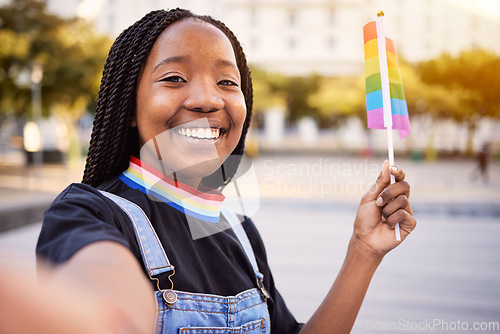 Image of Black woman portrait, gay selfie and rainbow flag for lgbtq pride with a smile for sexuality freedom. Young lesbian girl in the city for equality and love for non binary and gender neutral lifestyle