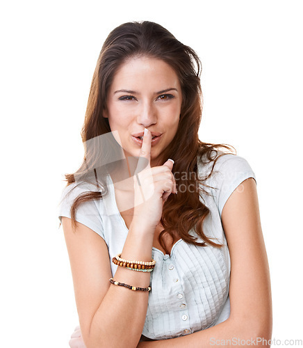 Image of Portrait, secret and confidential with a finger on lips woman in studio on a white background for gossip. Face, quiet and hand gesture with an attractive young female posing to whisper for silence