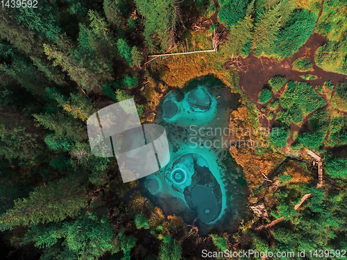 Image of Geyser (blue, silver) lake with thermal springs