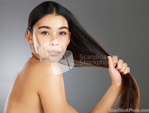 Image of Woman, hair care and beauty in studio portrait for strong, healthy natural shine and wellness by background. Model, hair glow and cosmetic beauty for health, aesthetic and confidence by backdrop