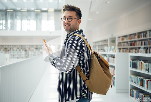 Image of Student man, library portrait and phone, smile and chat on social media for communication. College student, smartphone and app for university email in education, learning and studying for future goal