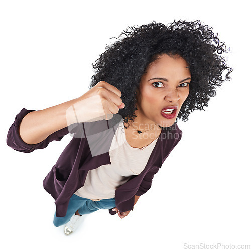 Image of Angry, crazy and portrait of a black woman with a fist for a fight isolated on a white background. Conflict, anger and African girl frustrated, threatening and violent on a studio background