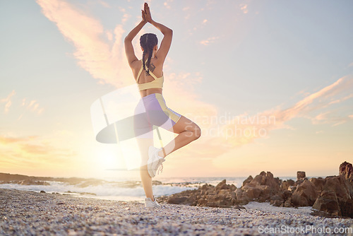 Image of Beach, yoga or woman stretching in fitness training, body workout or exercise for natural balance in Miami, Florida. Mindfulness, breathing or healthy zen girl exercising at sunset with calm peace