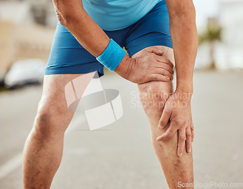Image of Fitness, knee pain and hands of senior man with muscle ache, painful joint and injury after running in city. Sports, body wellness and male athlete rest after workout, marathon training and exercise