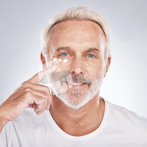 Image of Skincare, beauty and senior man with cream on white background for beauty, wellness and dermatology. Cosmetics, grooming and elderly male with anti aging beauty products, facial treatment and lotion