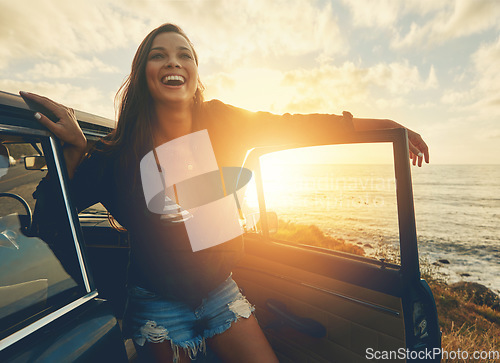 Image of Happy, car and woman on a road trip at the beach for summer, freedom and travel in Spain. Smile, adventure and girl driving on holiday at the ocean for happiness, content and peace with transport