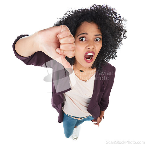 Image of Portrait, thumbs down and top view of black woman in studio isolated on white background. Dislike emoji, failure hand gesture and angry female with sign for disagreement, rejection or negative review