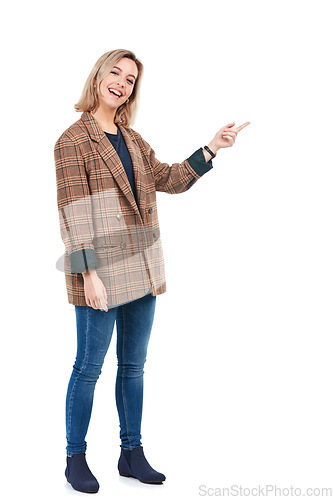 Image of Fashion portrait, woman and pointing to mockup in studio isolated on a white background. Product placement, marketing promotion and happy young female show mock up for advertising space or branding.
