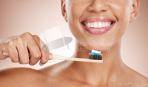 Image of Woman, cosmetics and brushing teeth for dental hygiene, smile and clean mouth on studio background. Female, girl and tooth brush for oral health, healthcare and fresh breath for natural care or relax