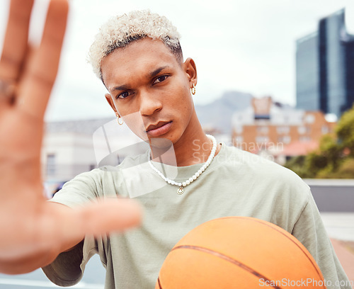 Image of Sports, selfie and basketball player with fashion with a ball standing on an outdoor court. Fitness, edgy and cool man model and athlete from Brazil posing for a picture with a casual outfit in city