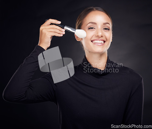 Image of Makeup, brush or portrait of woman in studio with beauty cosmetics or facial foundation products on black background. Makeup artist, smile or happy girl brushes face for luxury skincare grooming