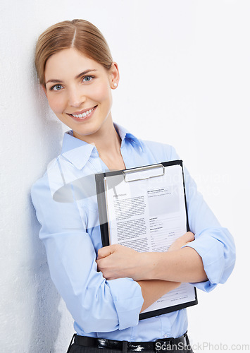 Image of Portrait, documents and mockup with a business woman in studio on a white background for a research review. Marketing, advertising or contract with a female employee holding a survey or questionnaire