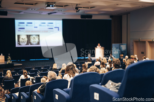 Image of Speaker giving a talk on scientific conference. Audience at the conference hall. Business and Entrepreneurship concept.