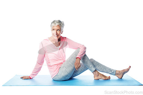 Image of Yoga, fitness and senior woman in studio isolated on a white background. Zen chakra, pilates and retired, elderly and happy female model sitting on mat, thinking and training for health and wellness.