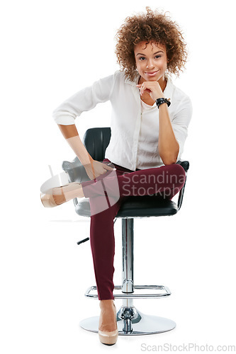 Image of Confident, happy and portrait of a black woman on a chair isolated on a white background in studio. Professional, young and beautiful, African and smiling girl sitting on a studio background