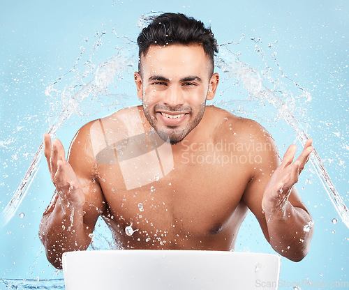 Image of Cleaning, water splash and portrait of man happy with self care routine, facial hygiene and body hygiene wash. Water drop, bathroom skincare hydration and beauty model with health wellness treatment